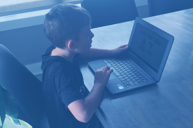 Boy learning online from home
